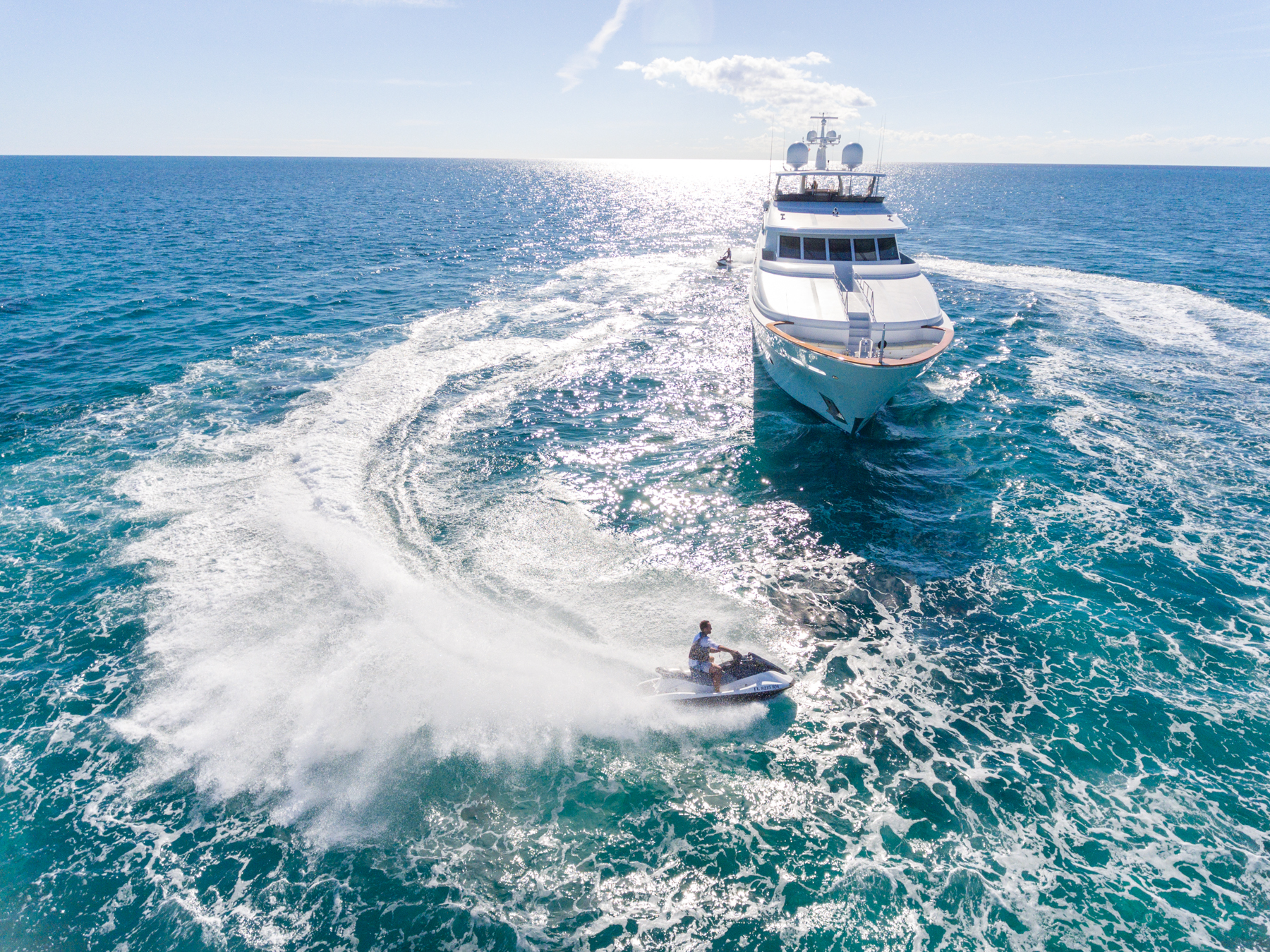 MISS STEPHANIE in the water with jet ski from the bow